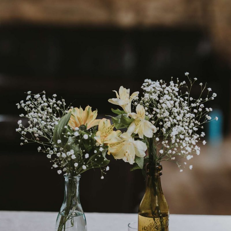 thin tinted vases with Baby's Breath