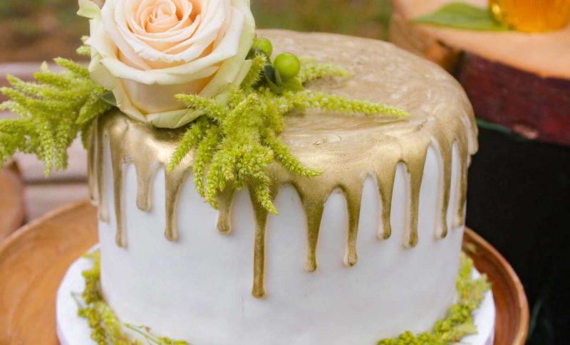 white cake with metallic gold drizzle